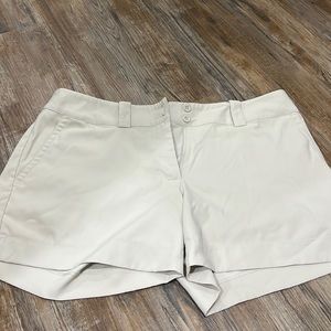 Nike khaki dry-fit material golf shorts.